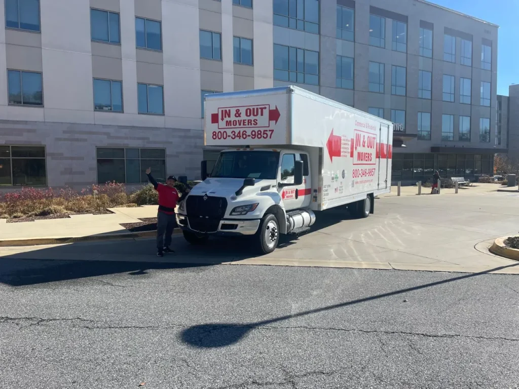 In & Out Movers truck outside a modern apartment building during a professional move for clients moving to Washington DC.