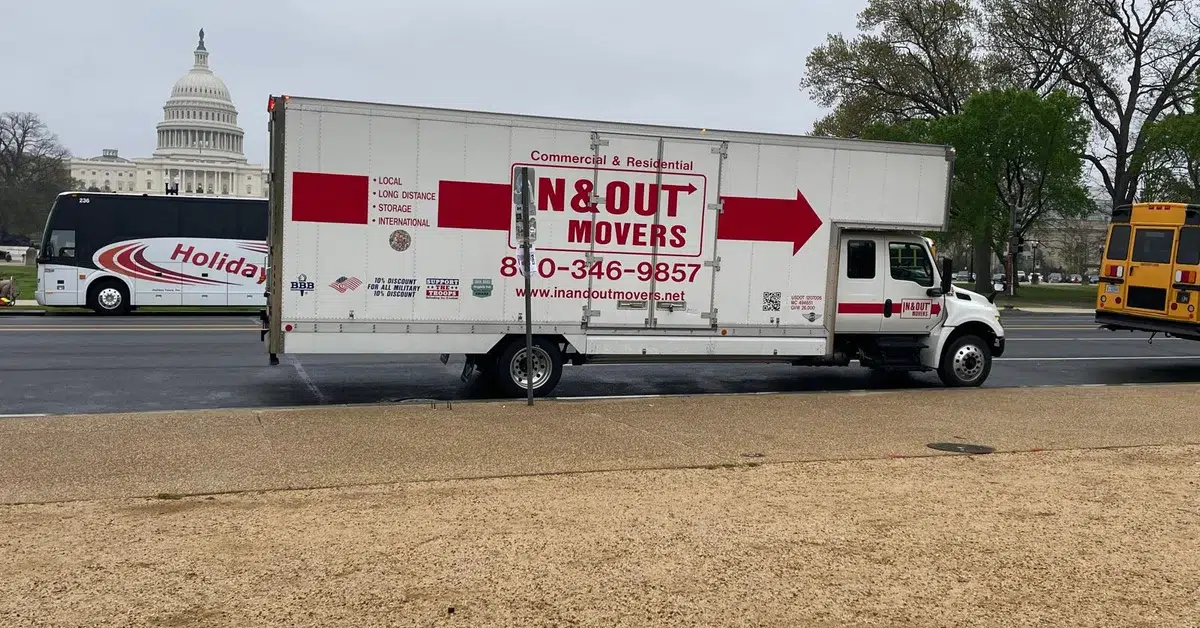 Professional office relocation team moving furniture and equipment in a Northern Virginia office building